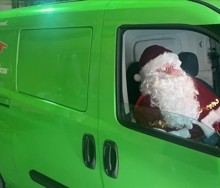 Santa in a SERVPRO car.