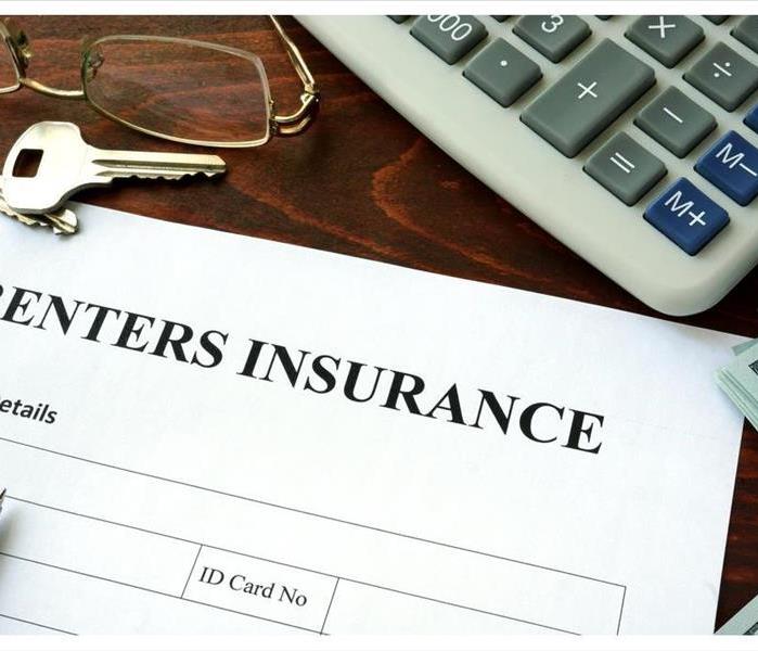 Renters insurance form and dollars on the table.